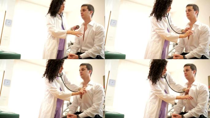 医生倾听病人的心脏。