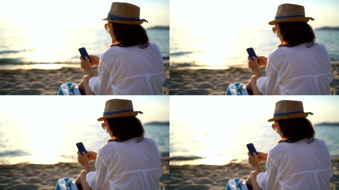 在海滩上使用手机