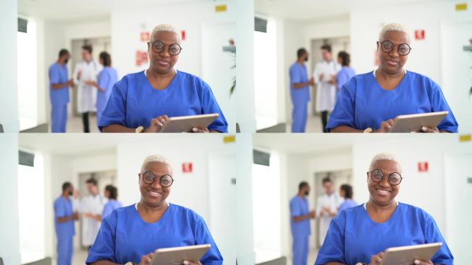 女护士在医院使用平板电脑的画像