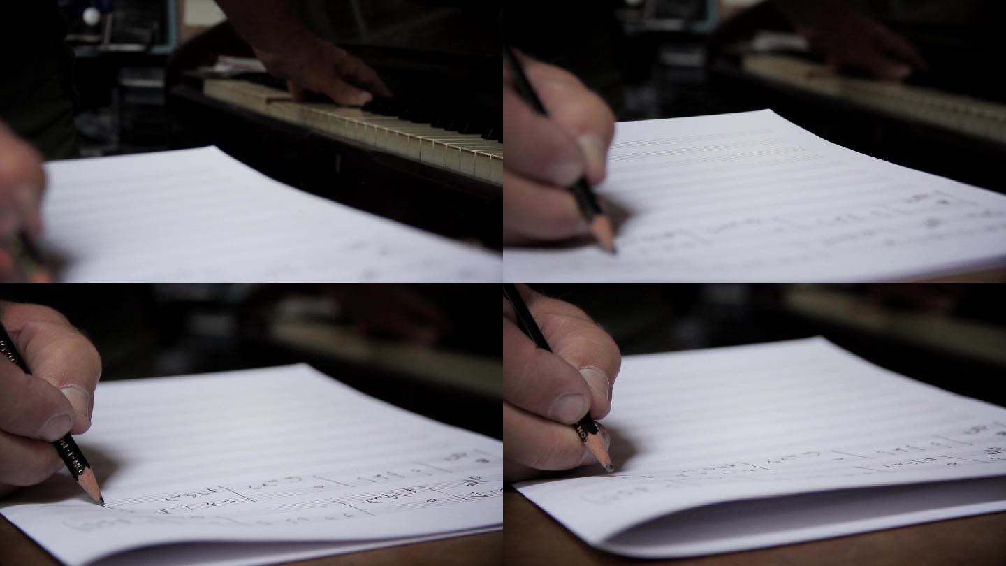男性用铅笔书写音符。