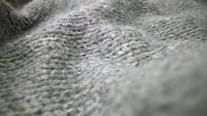 羊毛织物纹理在镜头中流动的极端细节视图