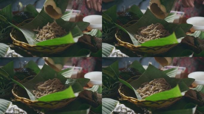 云南农村把虫子放在竹筒里烤制美食
