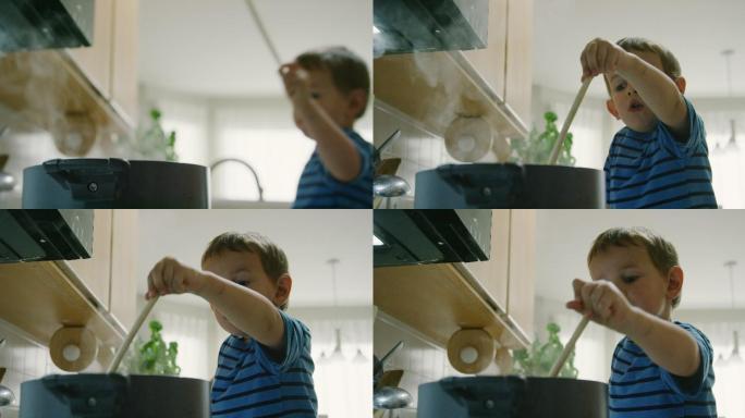 男孩在厨房炉灶上的一个大锅里搅拌