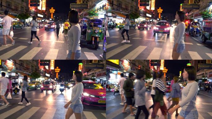 曼谷唐人街妇女夜间横穿马路