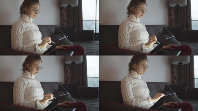少女在现代笔记本电脑上画画