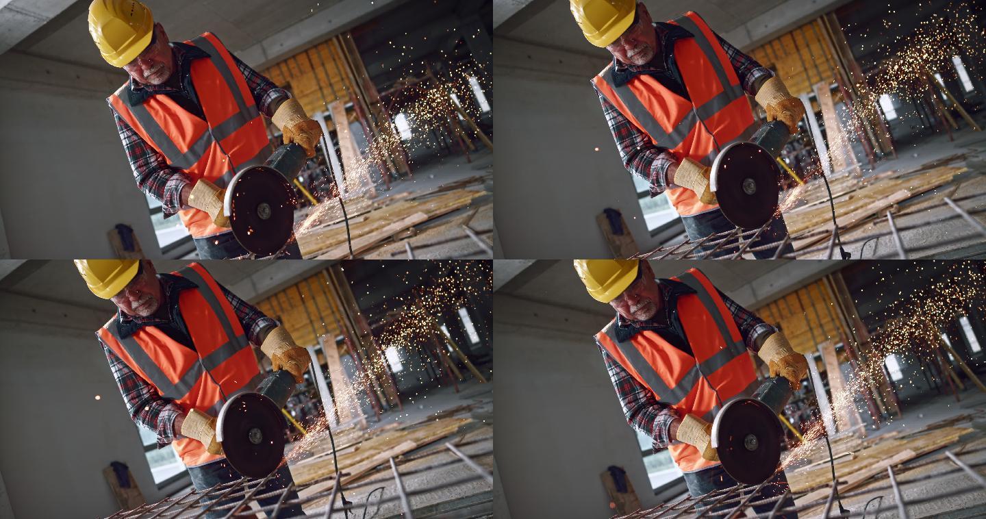 男建筑工人手持角磨机切割钢材