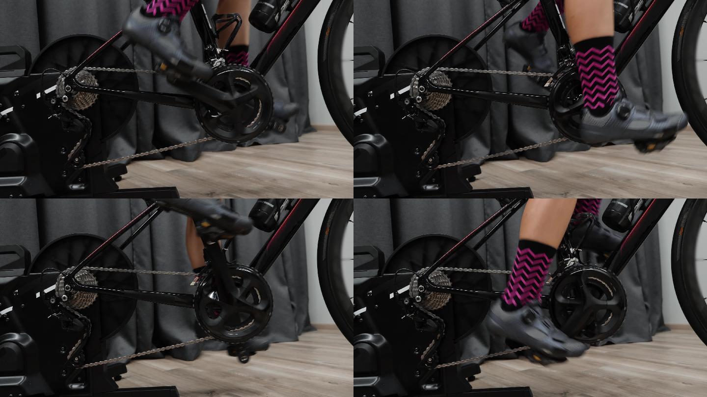 在室内智能自行车教练机上蹬腿。
