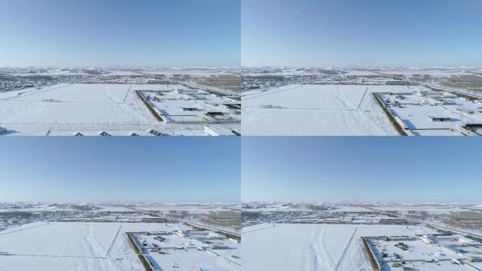 空镜航拍冬季广阔雪山震撼雪景村落山脚