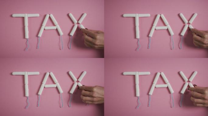 用卫生棉条拼写“tax”一词