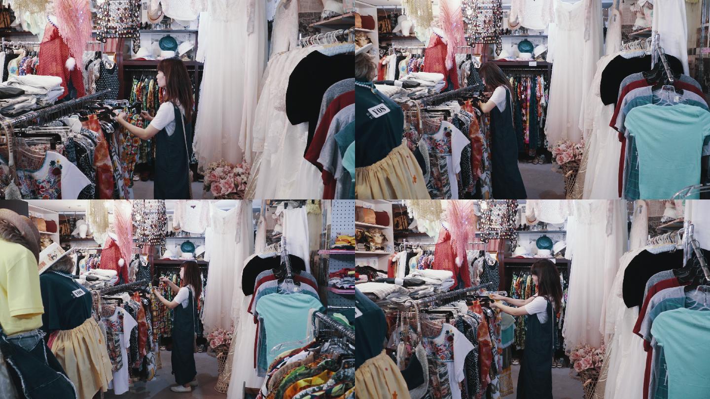 年轻女性顾客在旧货店购买复古服装