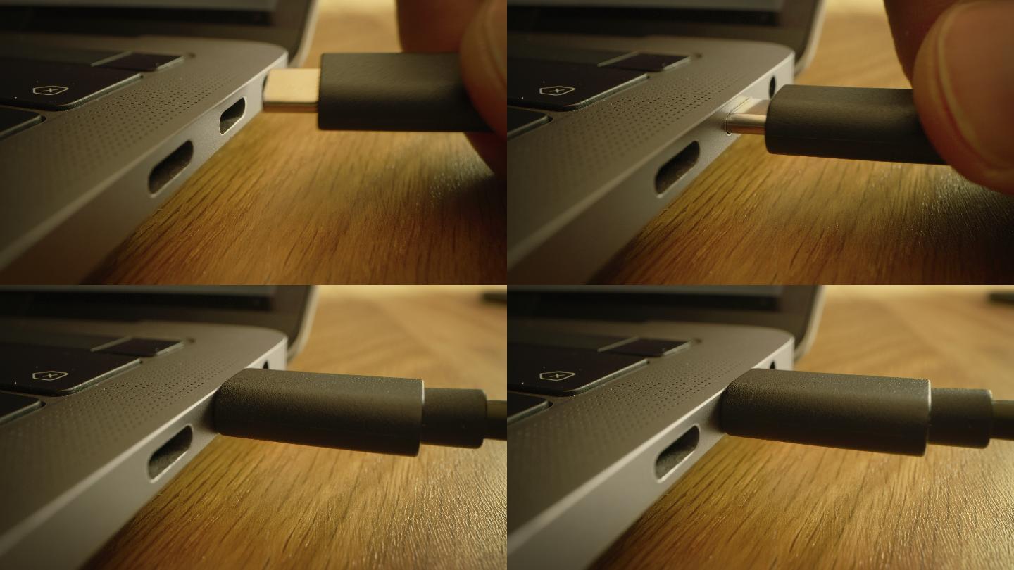 桌上的笔记本电脑雷电接口苹果充电