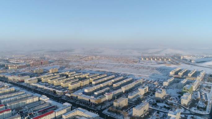 冬天冬季雪地航拍小镇城市雪山内蒙古空镜