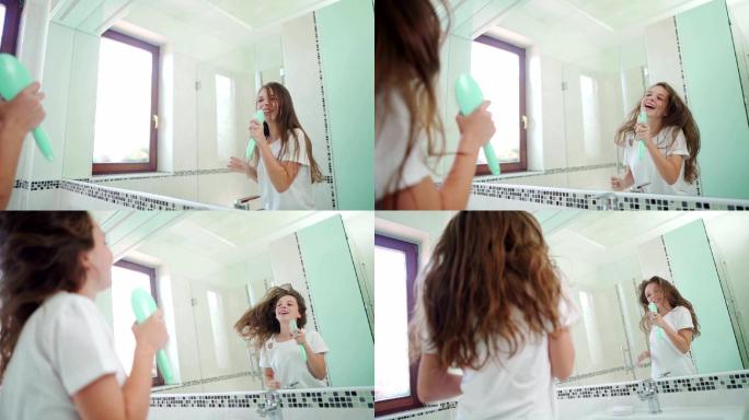 少女正在浴室里对着镜子用毛刷当麦克风唱歌