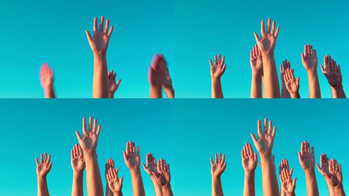 在蓝天下举手举手人群