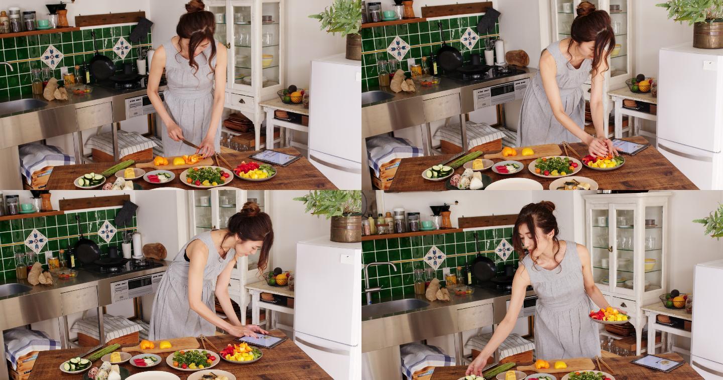 女子使用数字平板电脑烹饪食谱的广角镜头