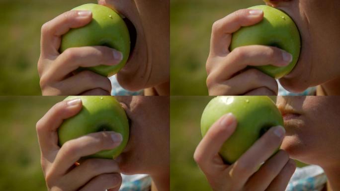 吃青苹果特写镜头大口吃青苹果嘴部特写