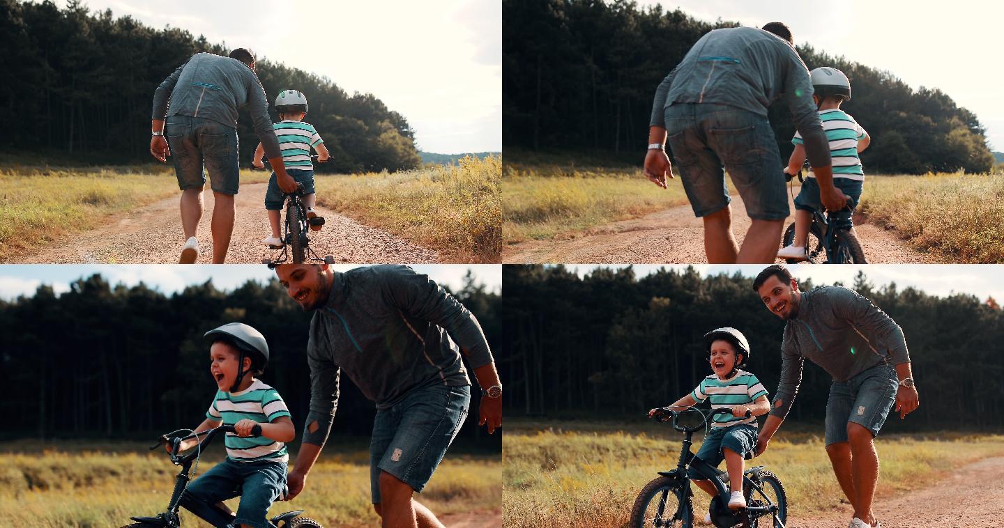 父亲教他的小儿子骑自行车
