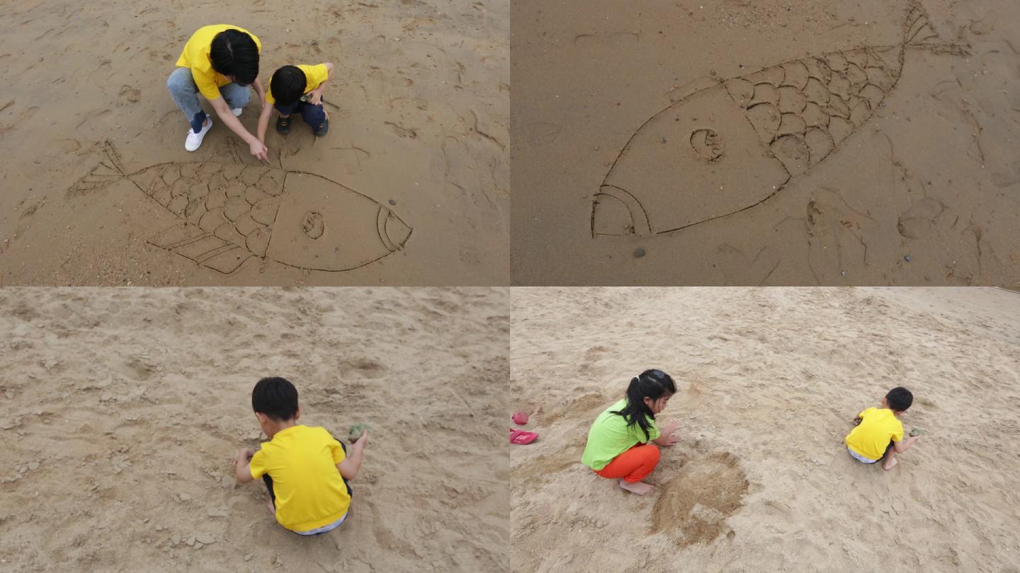 妈妈带孩子在海边玩沙子画画