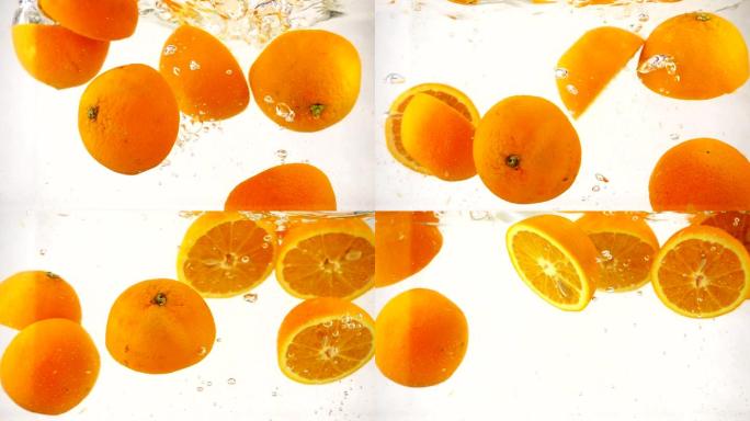 多汁的橙子一半浸在水中