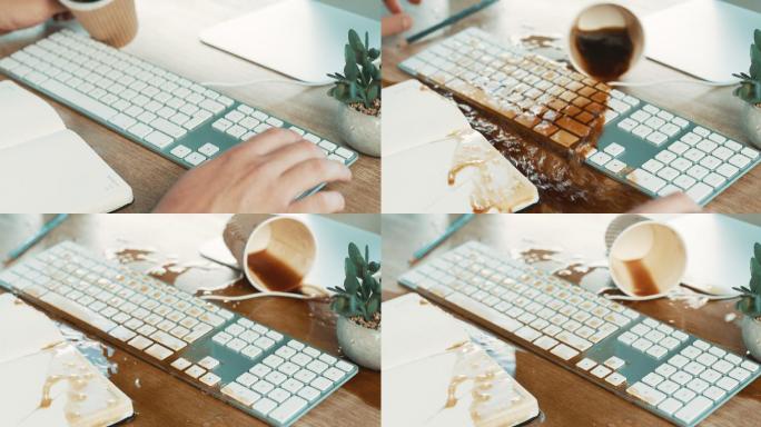 一个商人在工作时将咖啡洒在电脑键盘上