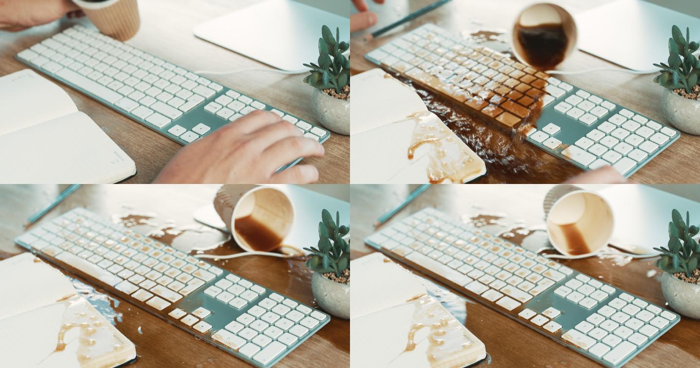 一个商人在工作时将咖啡洒在电脑键盘上