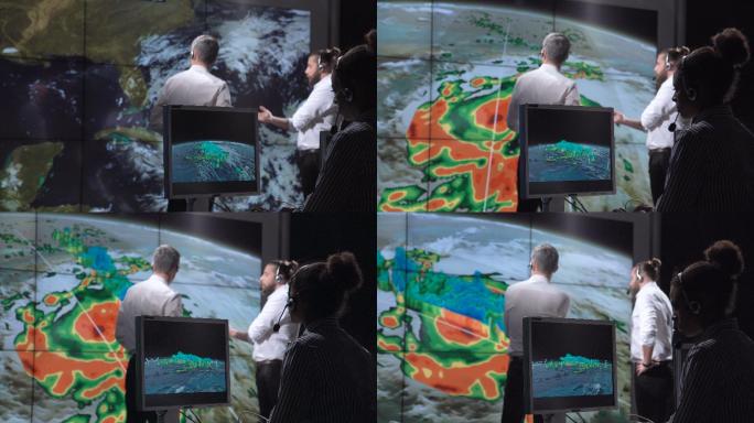 研究人员在监视器上跟踪飓风