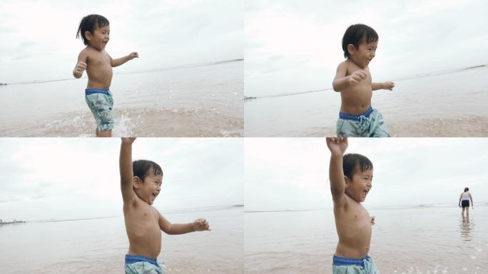 孩子在沙滩上行走慢动作升格镜头小孩