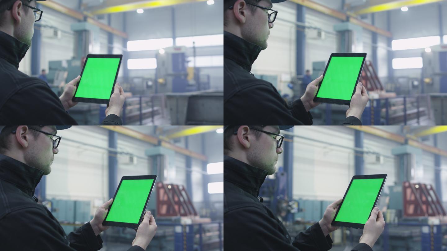 一名工人在工厂的中使用平板电脑