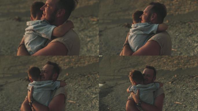 一个男人抱着他儿子