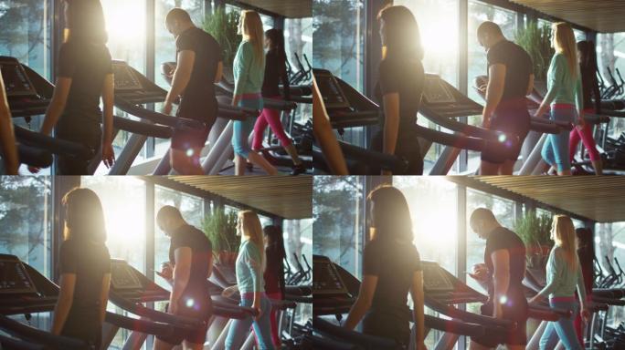 运动员在健身房的跑步机上锻炼