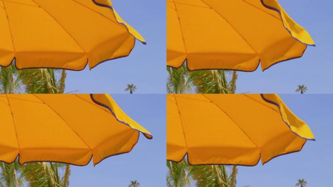 黄色的伞海边风光实拍视频特写镜头