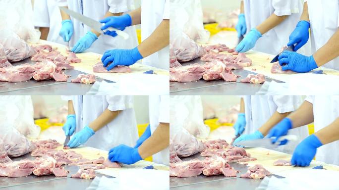 屠夫在猪肉厂的桌子上把猪肉剁碎切片