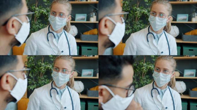 女医生戴着口罩和男病人交谈