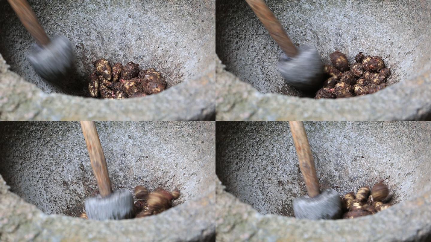 中国传统农家石臼捣臼捣芋艿原素材