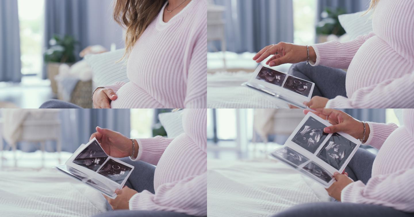 一位母亲坐在床上看着婴儿的的超声波图像