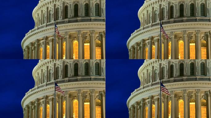 黄昏的美国国会大厦挂着美国国旗