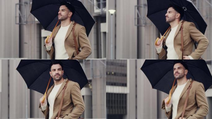 一个年轻人带着雨伞穿过城市
