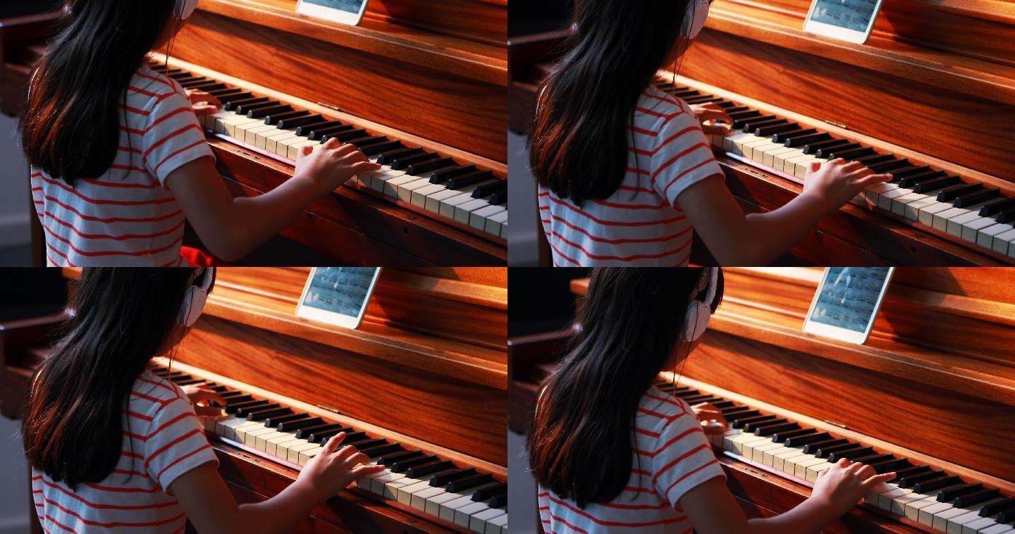 女学生在音乐课上学习钢琴