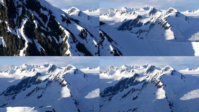 阳光下的雪山冰山山峰航拍雪景雄伟壮观