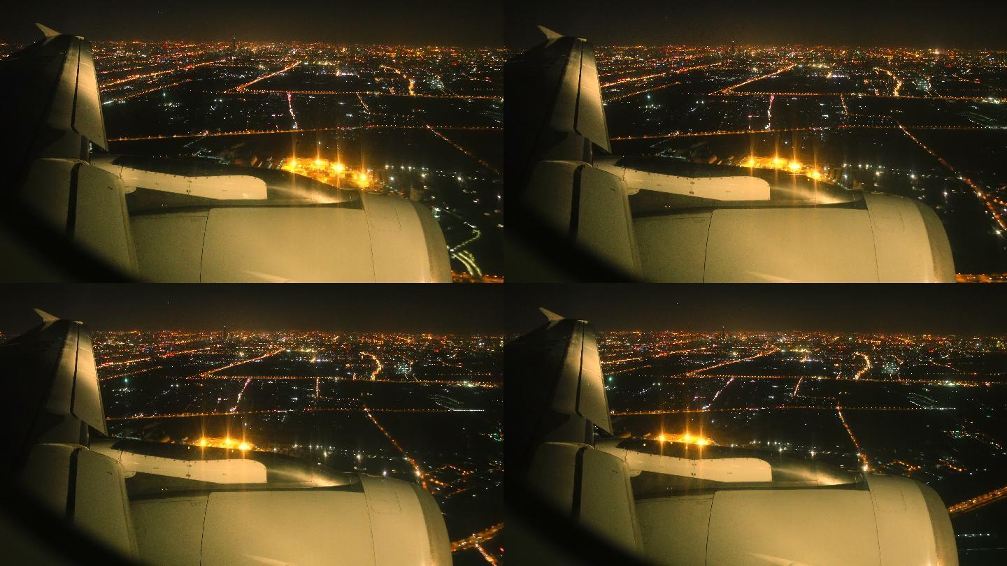 夜晚飞机飞过城市上空