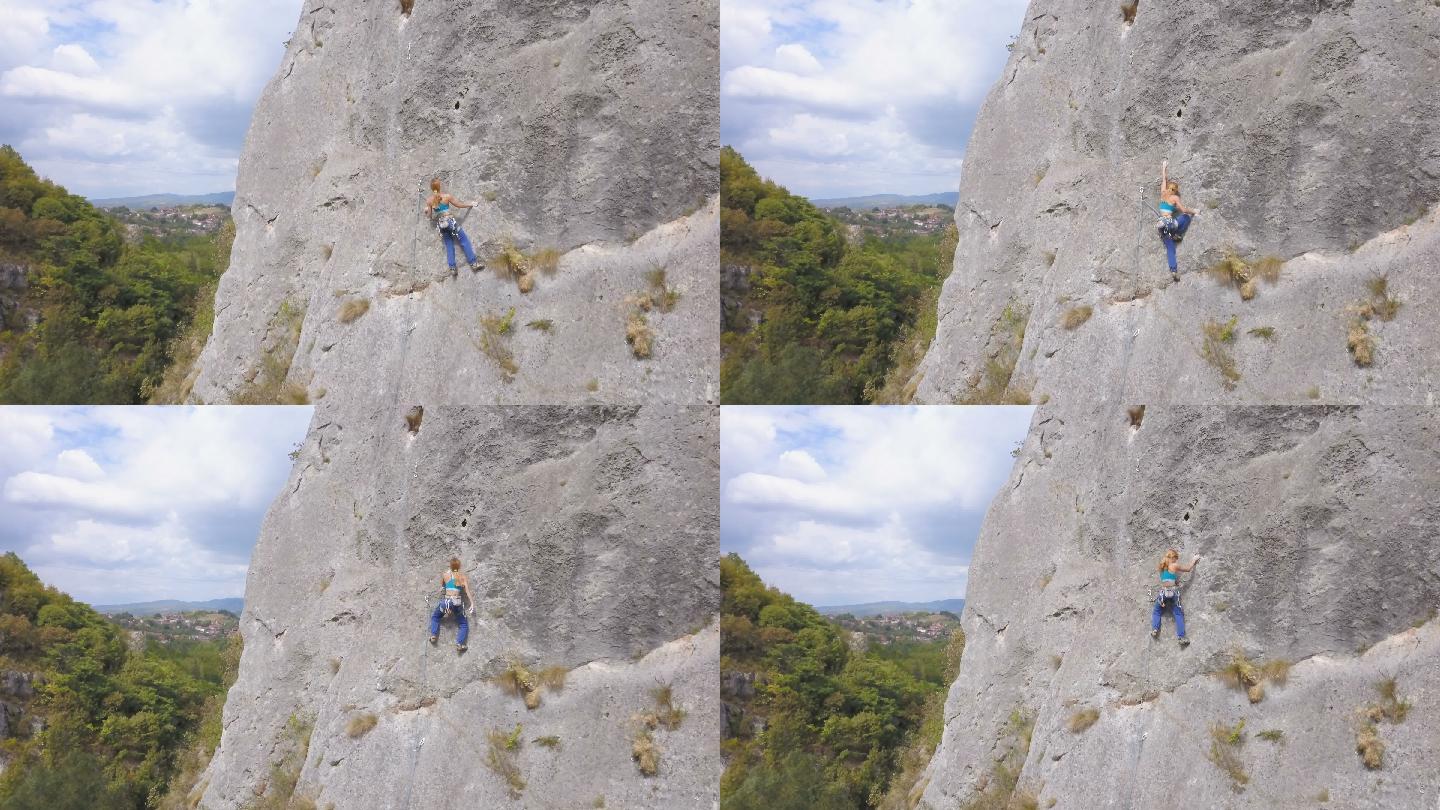 年轻女子攀登岩石