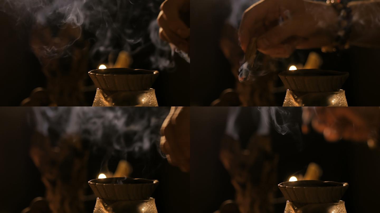 在中国茶道上，香烛燃烧着烟。