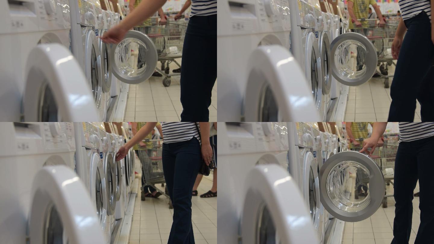女人在家电商店里选购洗衣机