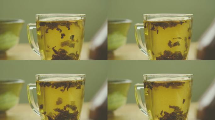 茶杯中的茶叶实时泡茶茶叶特写室内饮茶