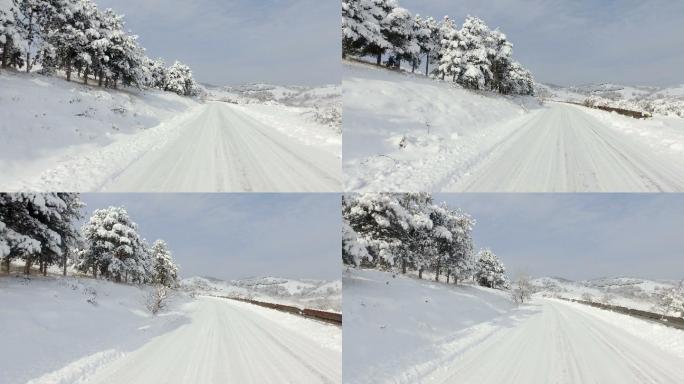 道路上堆积的雪冬季雪山大雪覆盖白雪道路