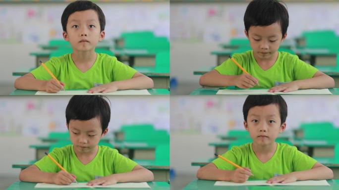 这个小男孩在上课录像机学习书