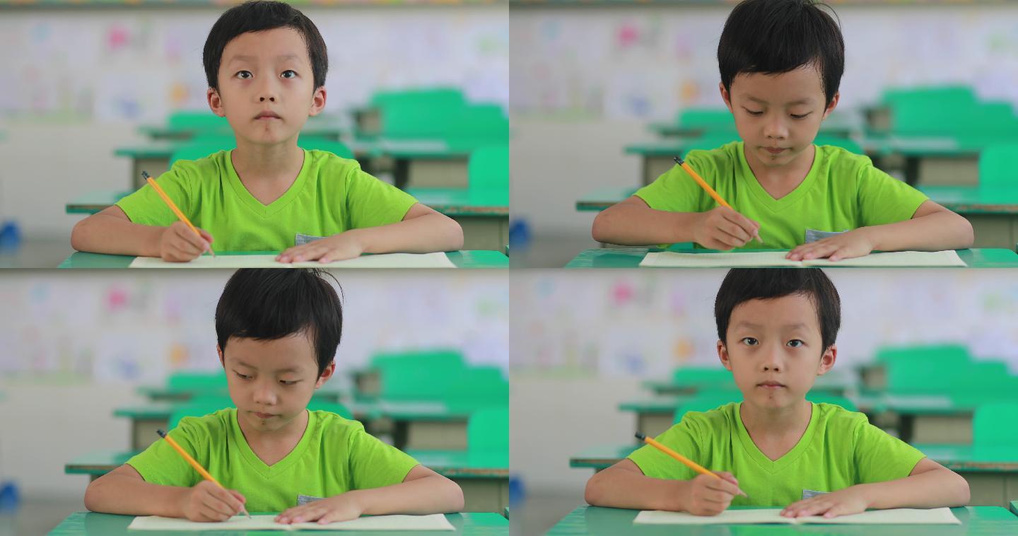 这个小男孩在上课录像机学习书