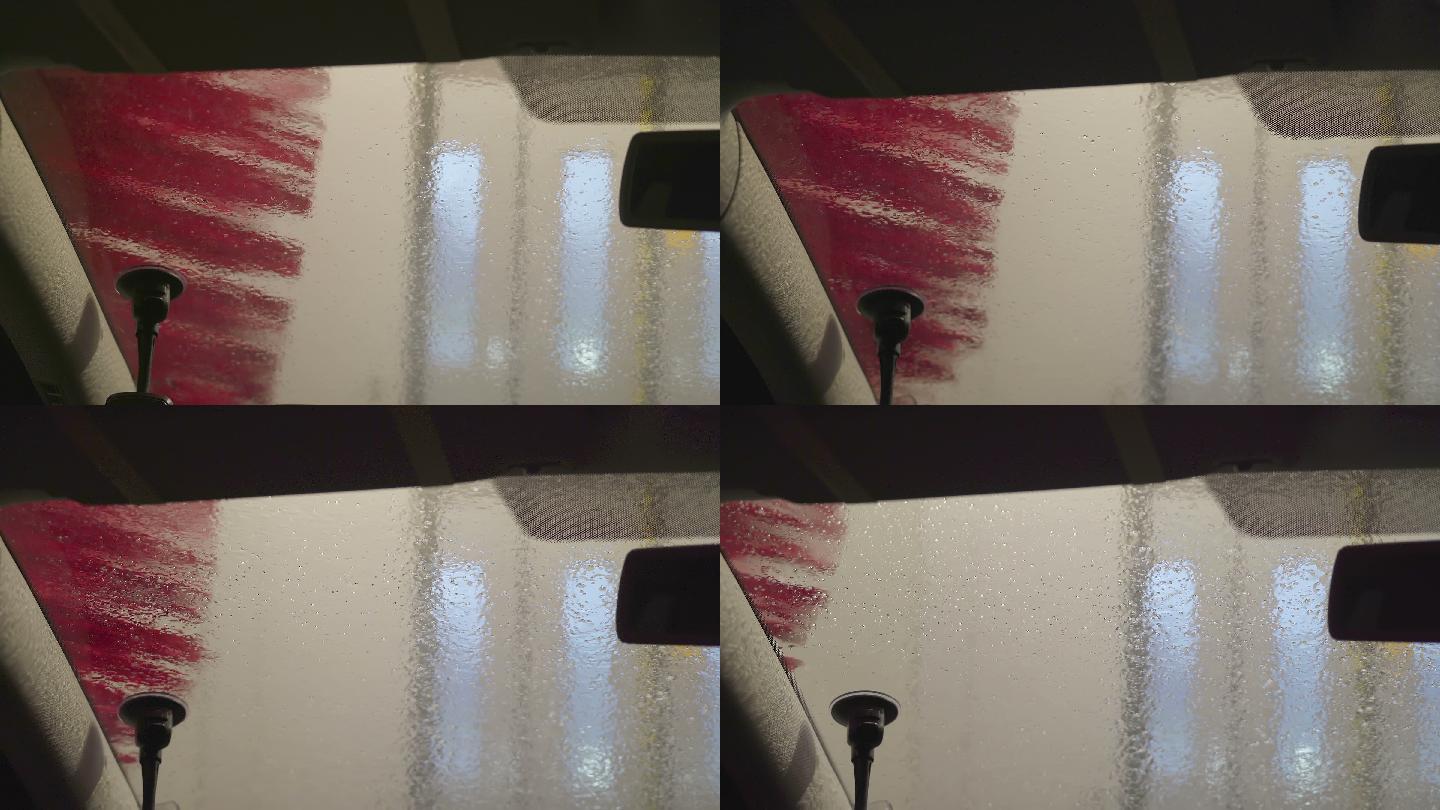 旁边的大红刷子在洗车站清洗汽车