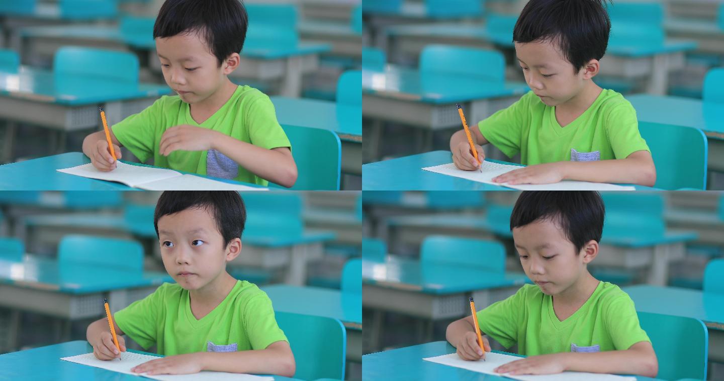 男孩在上课学习小学生考试写字