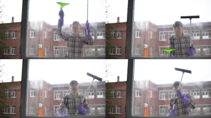 年轻女子清理窗户清洁工擦玻璃打扫卫生